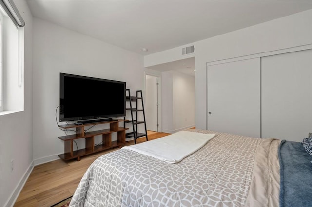 1029 White Knoll Dr, Los Angeles, CA 90012 - bedroom with light wood-type flooring and a closet