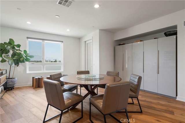 1029 White Knoll Dr, Los Angeles, CA 90012 - dining room with light wood-style flooring and recessed lighting