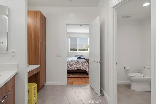 1029 White Knoll Dr, Los Angeles, CA 90012 - ensuite bathroom featuring vanity, tile patterned floors, and recessed lighting
