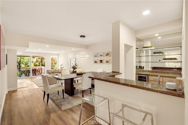 13078 Mindanao Way Unit 211, Marina Del Rey, CA 90292 - dining room featuring beverage cooler, bar with sink, wood finished floors, and recessed lighting