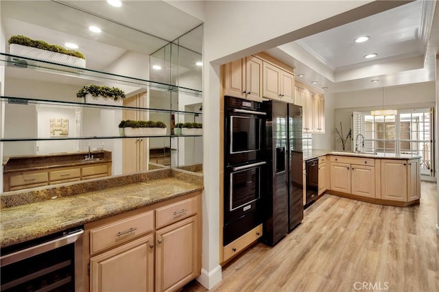 13078 Mindanao Way Unit 211, Marina Del Rey, CA 90292 - kitchen with black appliances, wine cooler, a peninsula, light wood-style floors, and light brown cabinets