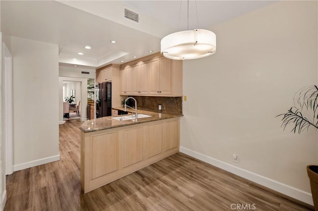13078 Mindanao Way Unit 211, Marina Del Rey, CA 90292 - kitchen with light wood-style flooring, stone countertops, a peninsula, recessed lighting, and decorative backsplash