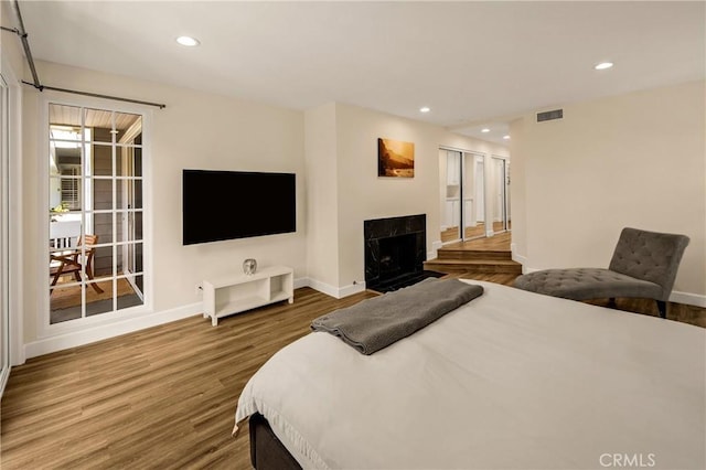 13078 Mindanao Way Unit 211, Marina Del Rey, CA 90292 - bedroom with wood finished floors, recessed lighting, and a fireplace