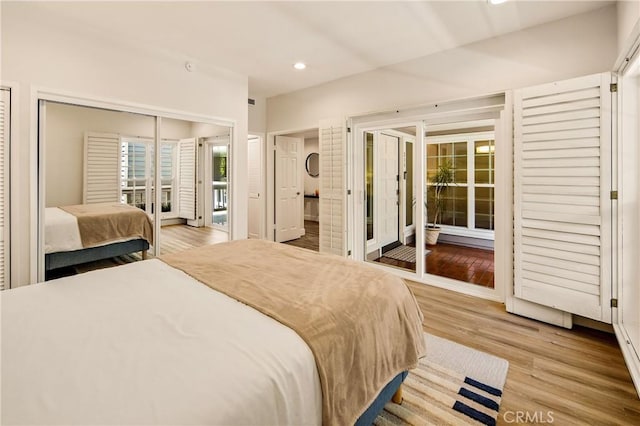 13078 Mindanao Way Unit 211, Marina Del Rey, CA 90292 - bedroom with access to outside, recessed lighting, and wood finished floors