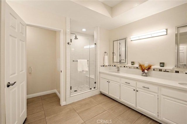 13078 Mindanao Way Unit 211, Marina Del Rey, CA 90292 - bathroom featuring a stall shower, double vanity, tile patterned floors, and recessed lighting