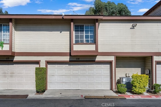 8939 Gallatin Rd Unit 116, Pico Rivera, CA 90660 - view of front of home featuring a garage