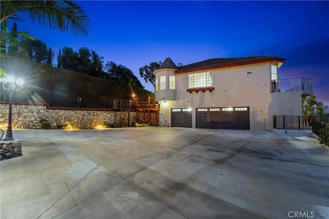 918 Reposado Dr, La Habra Heights, CA 90631 - view of home's exterior featuring a garage, stucco siding, concrete driveway, and a balcony