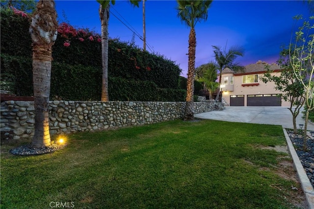 918 Reposado Dr, La Habra Heights, CA 90631 - view of green lawn featuring driveway and a garage