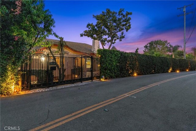 918 Reposado Dr, La Habra Heights, CA 90631 - view of front of property with a chimney and a gate
