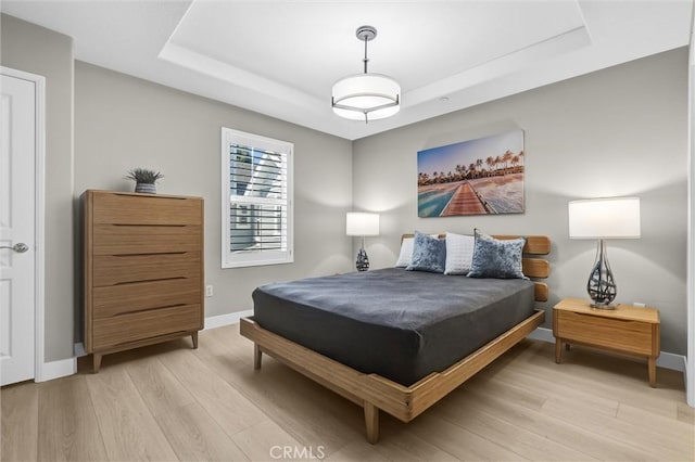 29 Hinterland Way, Ladera Ranch, CA 92694 - bedroom featuring a tray ceiling and light wood-style floors