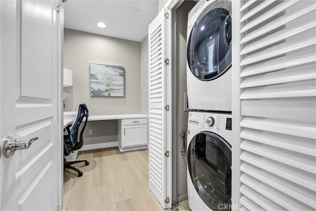 29 Hinterland Way, Ladera Ranch, CA 92694 - laundry room featuring stacked washing machine and dryer, light wood-style flooring, recessed lighting, and an office area