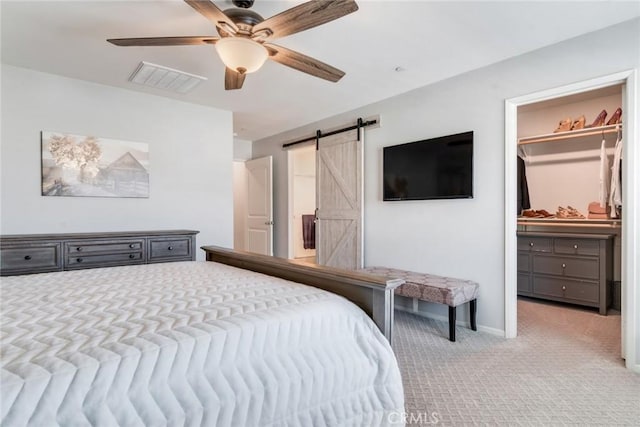 4989 River Ash Way, Fontana, CA 92336 - bedroom with carpet flooring, a barn door, and ceiling fan