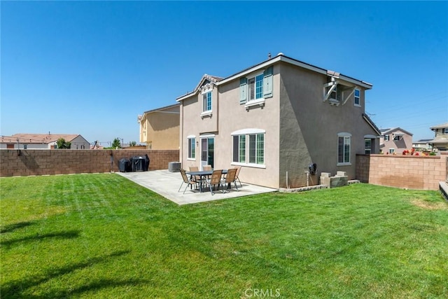 4989 River Ash Way, Fontana, CA 92336 - rear view of property with a fenced backyard, stucco siding, and a patio