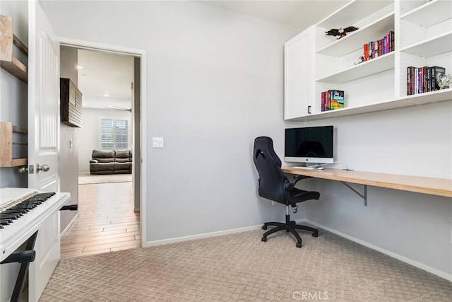 4989 River Ash Way, Fontana, CA 92336 - carpeted home office featuring built in study area and a ceiling fan