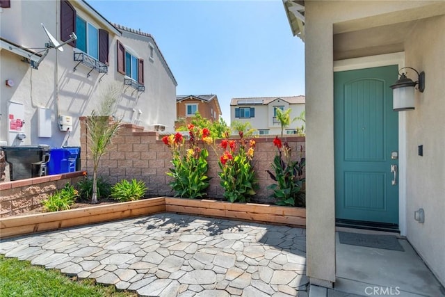 4989 River Ash Way, Fontana, CA 92336 - entrance to property with a patio area, stucco siding, and a residential view