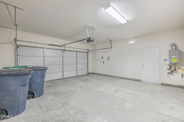 3016 Via Bella Rosa Ave, Rosamond, CA 93560 - garage featuring a garage door opener and water heater