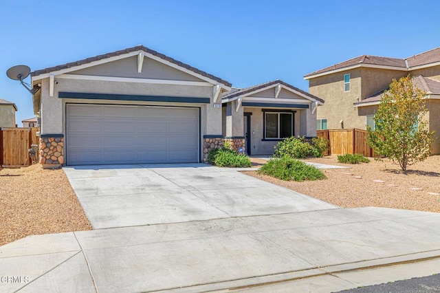 3016 Via Bella Rosa Ave, Rosamond, CA 93560 - ranch-style home featuring driveway, stone siding, and stucco siding