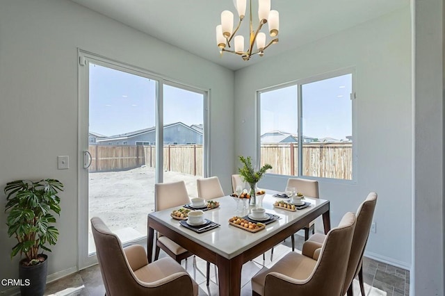 3016 Via Bella Rosa Ave, Rosamond, CA 93560 - dining area featuring a chandelier and plenty of natural light