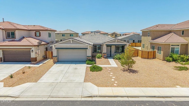 3016 Via Bella Rosa Ave, Rosamond, CA 93560 - view of front of home with a garage, driveway, a residential view, stucco siding, and a tiled roof