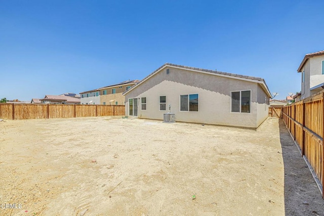 3016 Via Bella Rosa Ave, Rosamond, CA 93560 - rear view of house featuring stucco siding and a fenced backyard