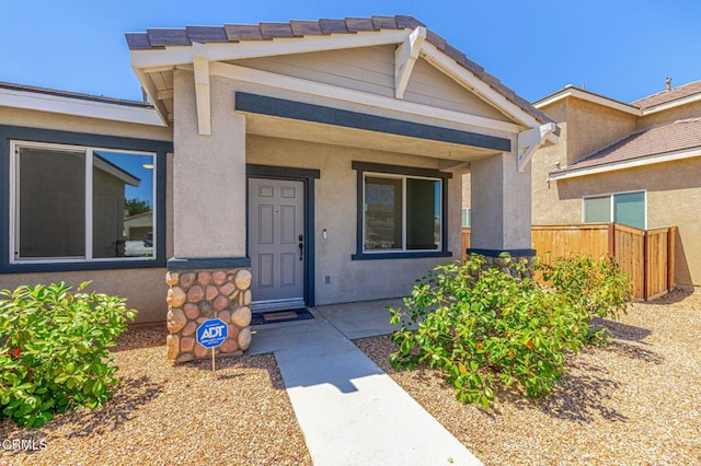 3016 Via Bella Rosa Ave, Rosamond, CA 93560 - doorway to property featuring covered porch and stucco siding