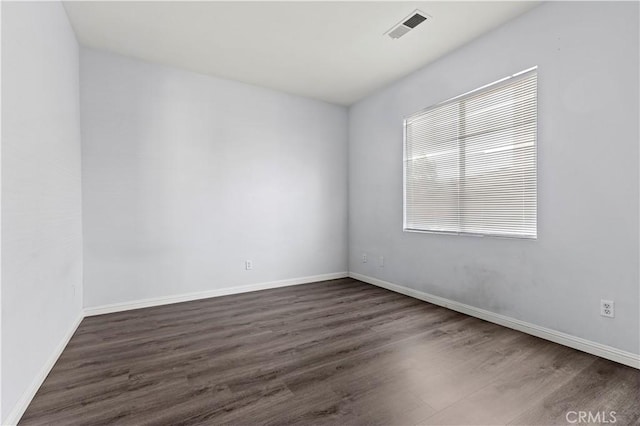 6219 S Kingsmill Ct, Fontana, CA 92336 - unfurnished room featuring dark wood-type flooring and baseboards
