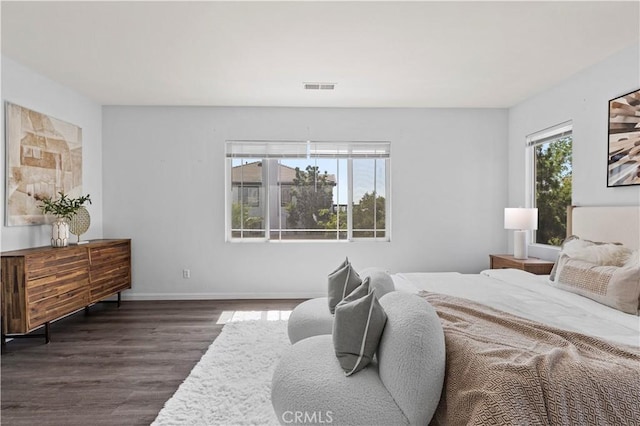 6219 S Kingsmill Ct, Fontana, CA 92336 - bedroom featuring dark wood-style flooring and multiple windows