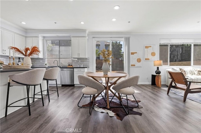6219 S Kingsmill Ct, Fontana, CA 92336 - dining space featuring ornamental molding, wood finished floors, and recessed lighting