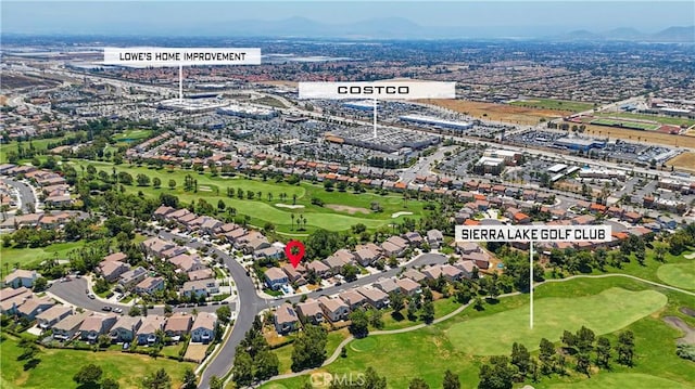 6219 S Kingsmill Ct, Fontana, CA 92336 - aerial view of residential area with a local golf course and mountains