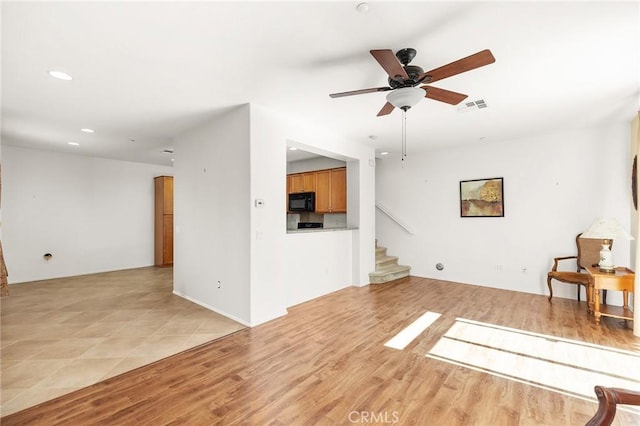 35842 Ellison Ln Unit 2, Murrieta, CA 92562 - unfurnished living room featuring recessed lighting, stairway, ceiling fan, and light wood-type flooring