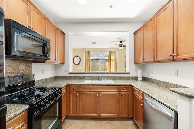 35842 Ellison Ln Unit 2, Murrieta, CA 92562 - kitchen with black appliances, ceiling fan, brown cabinets, and light stone countertops