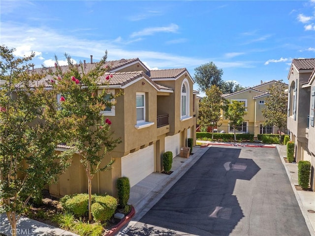 35842 Ellison Ln Unit 2, Murrieta, CA 92562 - view of home's community featuring an attached garage and driveway