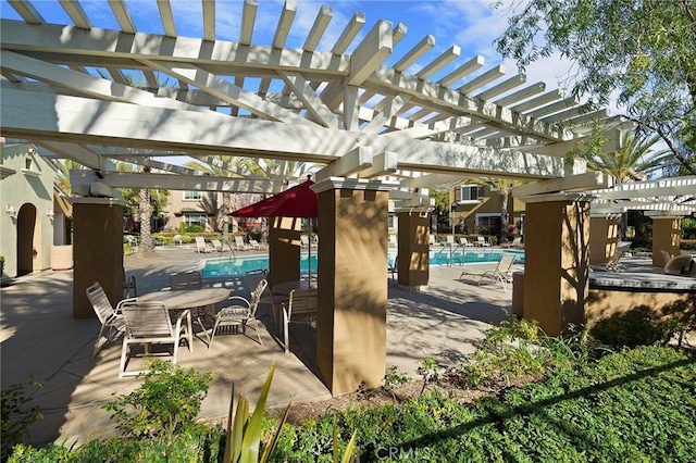 35842 Ellison Ln Unit 2, Murrieta, CA 92562 - view of patio / terrace featuring a pergola and a community pool