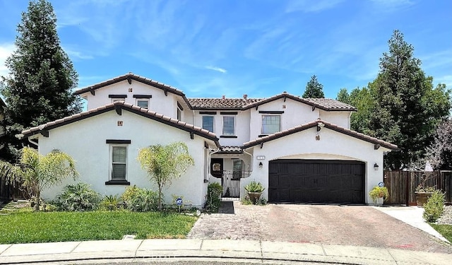 2001 Sola Ct, Atwater, CA 95301 - mediterranean / spanish-style home featuring concrete driveway, a tile roof, stucco siding, and a garage