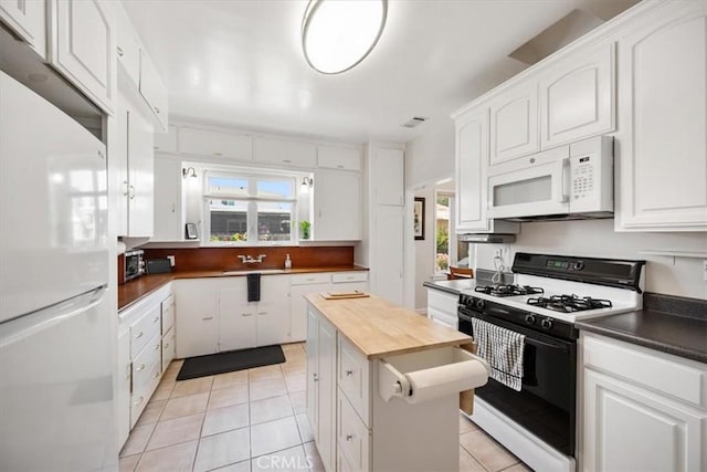 215 S Mason St, Arroyo Grande, CA 93420 - kitchen featuring white appliances, white cabinets, and light tile patterned floors