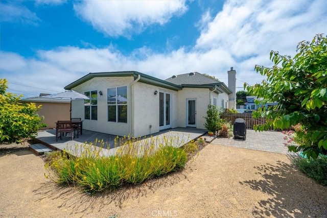 215 S Mason St, Arroyo Grande, CA 93420 - rear view of property featuring stucco siding, a chimney, a patio area, and a wooden deck