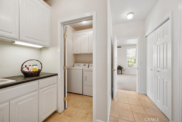 215 S Mason St, Arroyo Grande, CA 93420 - laundry area featuring washing machine and dryer, light tile patterned flooring, and cabinet space