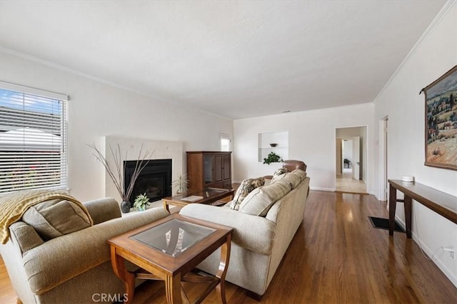 215 S Mason St, Arroyo Grande, CA 93420 - living room featuring a high end fireplace, wood finished floors, and crown molding