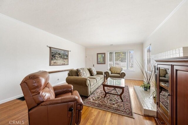 215 S Mason St, Arroyo Grande, CA 93420 - living area with light wood finished floors and ornamental molding