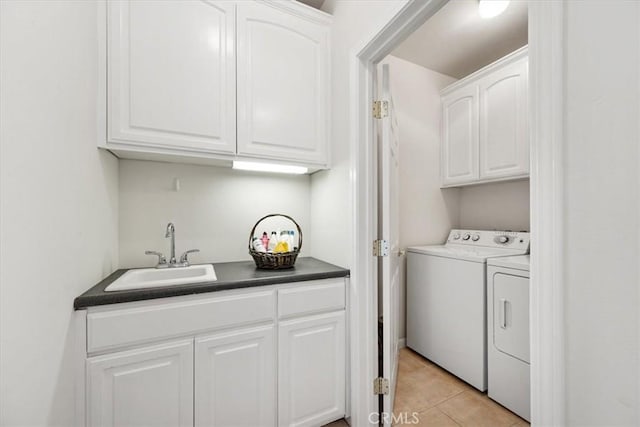 215 S Mason St, Arroyo Grande, CA 93420 - washroom featuring washing machine and clothes dryer, cabinet space, and light tile patterned floors