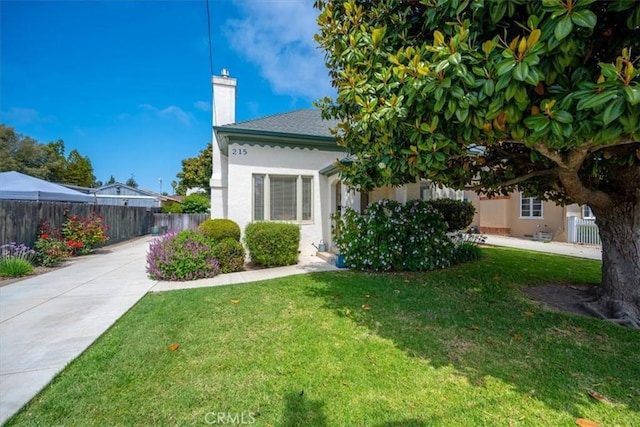 215 S Mason St, Arroyo Grande, CA 93420 - view of home's exterior with a chimney and stucco siding