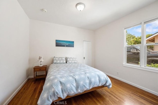 215 S Mason St, Arroyo Grande, CA 93420 - bedroom featuring baseboards and wood finished floors