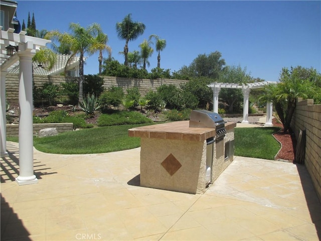 30118 Galbreth Ct, Castaic, CA 91384 - fenced backyard featuring exterior kitchen, a pergola, and a patio