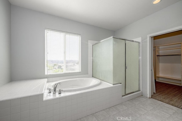 30118 Galbreth Ct, Castaic, CA 91384 - bathroom featuring a garden tub, a stall shower, a spacious closet, and tile patterned floors
