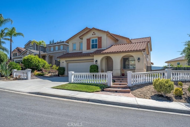 30118 Galbreth Ct, Castaic, CA 91384 - mediterranean / spanish-style home featuring driveway, stucco siding, and a fenced front yard