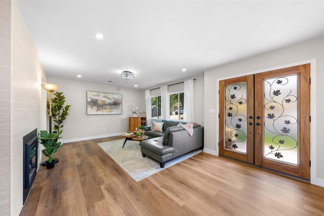 6270 Meadowcrest Dr, La Mesa, CA 91942 - living area featuring wood finished floors, recessed lighting, a tile fireplace, and french doors