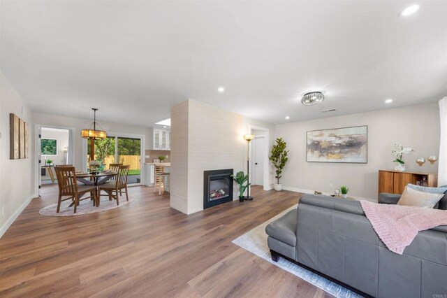 6270 Meadowcrest Dr, La Mesa, CA 91942 - living room featuring wood finished floors, recessed lighting, and a fireplace