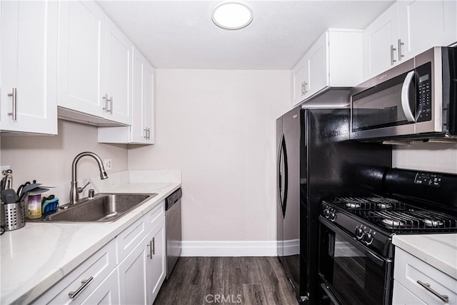 1000 Central Ave Unit 19, Riverside, CA 92507 - kitchen featuring appliances with stainless steel finishes, dark wood-style floors, white cabinetry, and light stone countertops