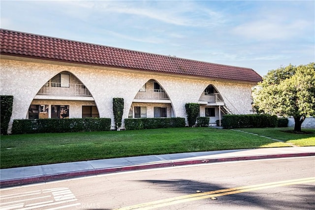 1000 Central Ave Unit 19, Riverside, CA 92507 - view of front of home featuring a front yard and stone siding