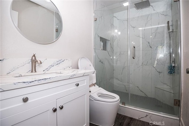 1000 Central Ave Unit 19, Riverside, CA 92507 - bathroom featuring a marble finish shower, vanity, and wood finished floors